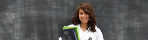 YMCA Academy student holding textbooks