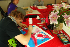 YMCA Academy students completing still life paintings in art class