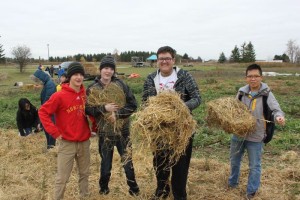 YMCA Academy students holding straw at YMCA Cedar Glen Outdoor Centre