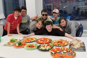 YMCA Academy students posing for a photo during cooking club.