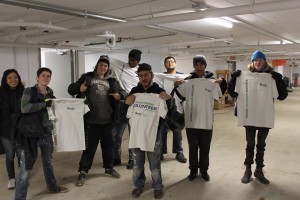 YMCA Academy students volunteering at a build site for Habitat for Humanity Holiday Campaign.