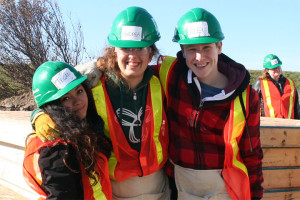 YMCA Academy students volunteering at a build site for Habitat for Humanity Holiday Campaign.