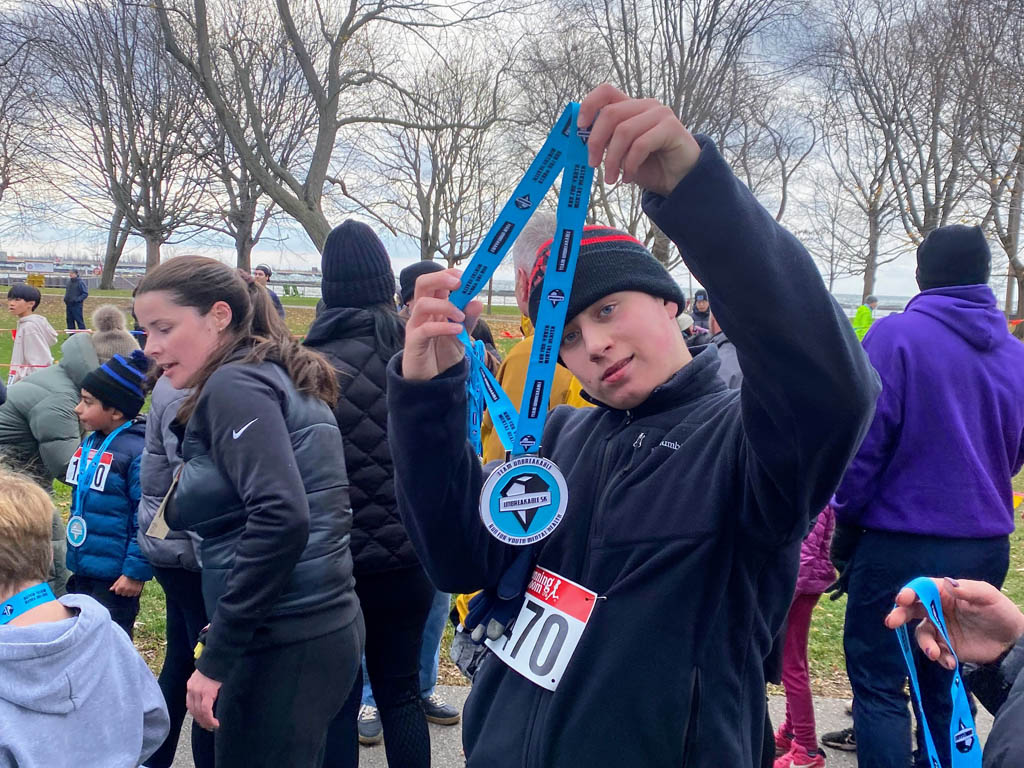 n November 30, the YMCA Academy Run Club, joined by friends and family (and even Tim!), participated in the Team Unbreakable Bold and Cold 5K.