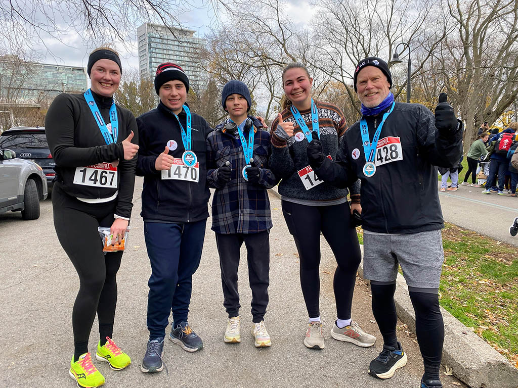 n November 30, the YMCA Academy Run Club, joined by friends and family (and even Tim!), participated in the Team Unbreakable Bold and Cold 5K.